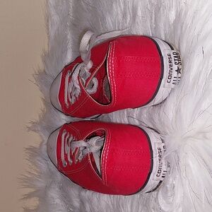 Red and white All Stars tennis shoes